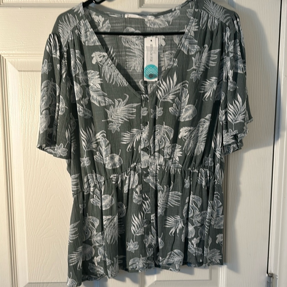Green and white floral blouse